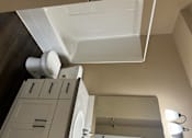 Thumbnail 38 of 48 - A white sink in a bathroom with a white cabinet above it.