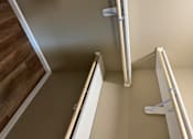 Thumbnail 48 of 48 - A white ladder is leaning against a wall.