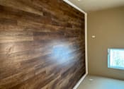 Thumbnail 43 of 48 - A wall of wood planks is on the wall.