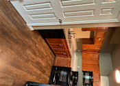 Thumbnail 47 of 48 - A white door with a handle is in the foreground of a wooden staircase.