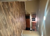 Thumbnail 21 of 48 - A wall of wood planks with a light shining on it.