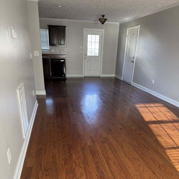 A room with wooden walls and a white ceiling.