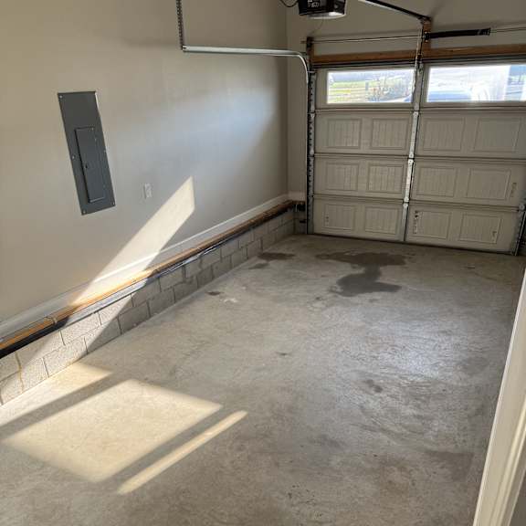 A room with a concrete wall and a window.