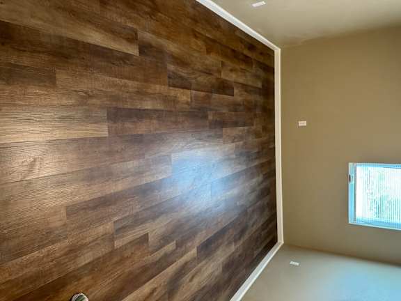 A wall of wood planks is on the wall.