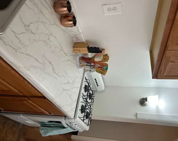 a kitchen counter with a bunch of items on it