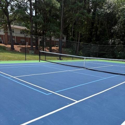 A blue running track with white lines.