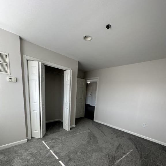 an empty closet in a bathroom with the door open at Carisbrooke at Manchester Apartments, New Hampshire