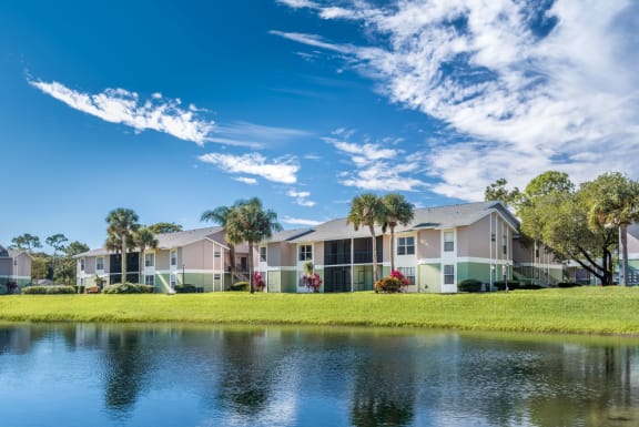 Lake view with apartments in the background.