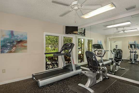 Community gym with cardio equipment.