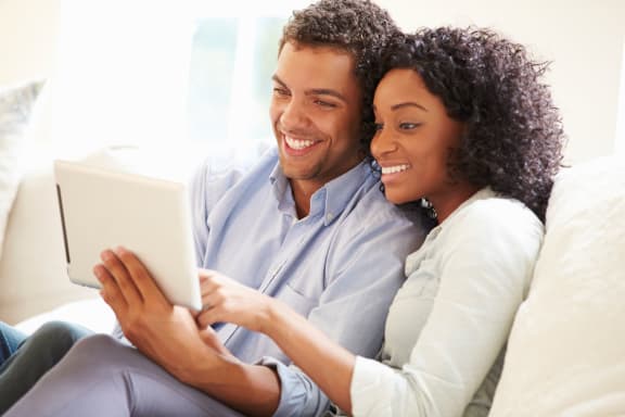 couple_using_tablet at Sumida Gardens Apartments, California, 93111