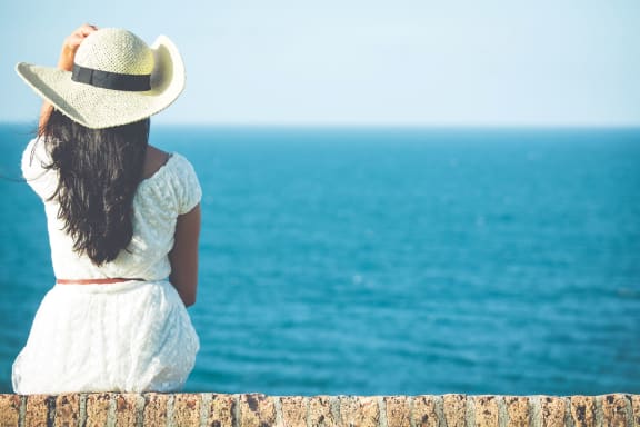 woman_looking_at_ocean at Sumida Gardens Apartments, California