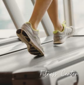 a woman running on a conveyor belt on a train