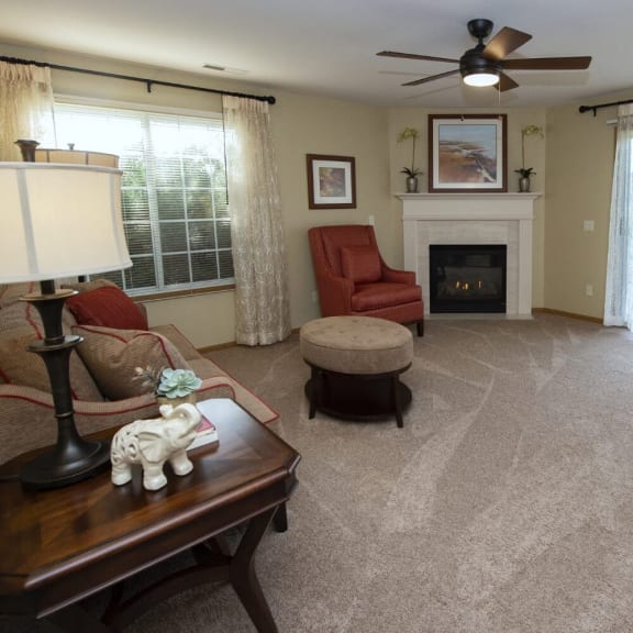 a living room filled with furniture and a fire place