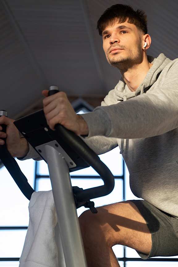 A man is exercising on a stationary bike at Beton Apartments, Wembley, HA9 0SL