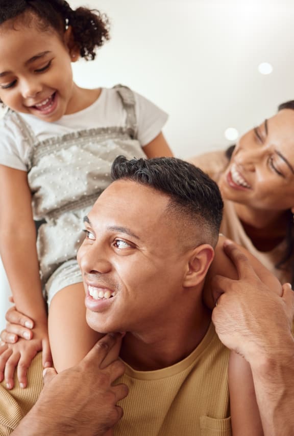 a man is sitting on the back of his family