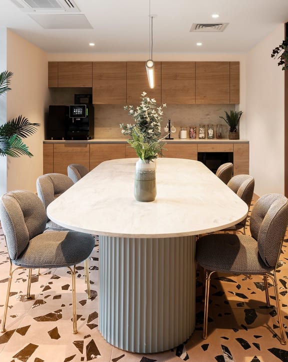 a dining room with a table and chairs