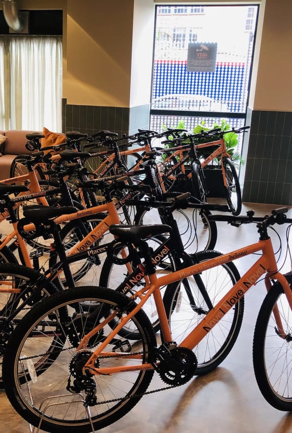 a bunch of bikes are lined up in a room
