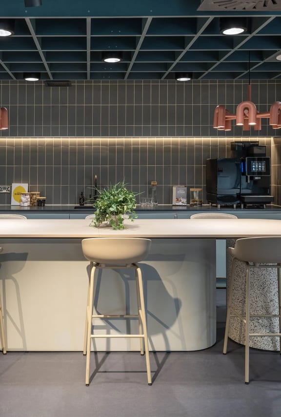 a kitchen with a counter top and a stool