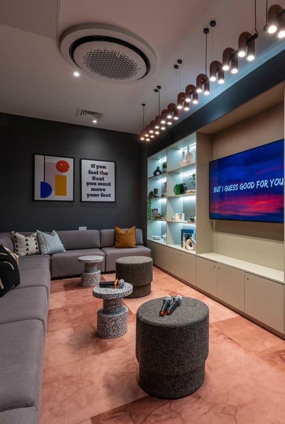 a living room with couches and a tv