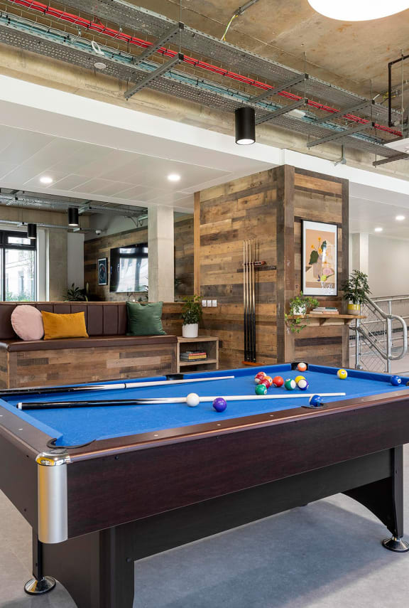 a pool table in the middle of a living room