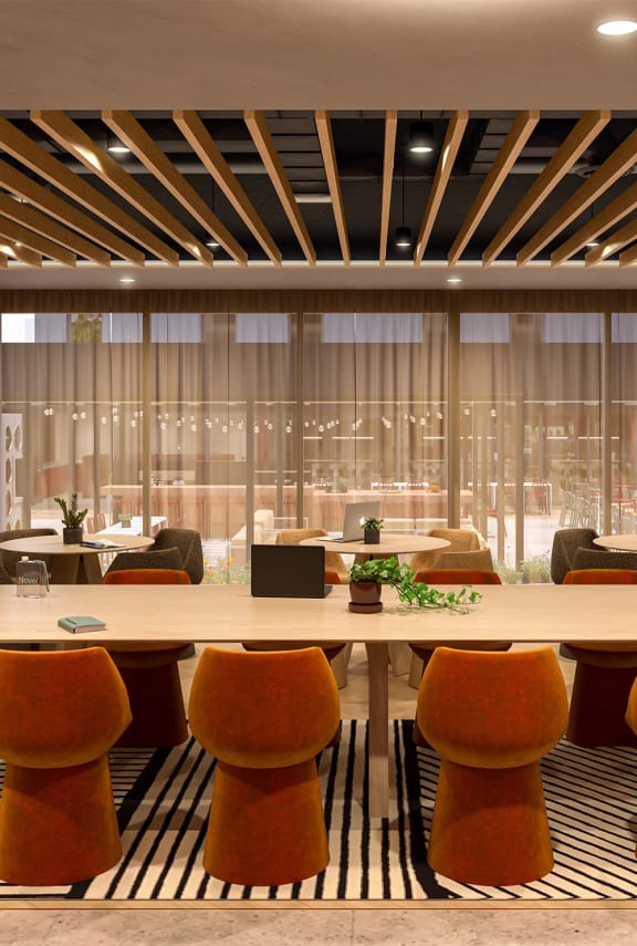 a large meeting room with a table and chairs