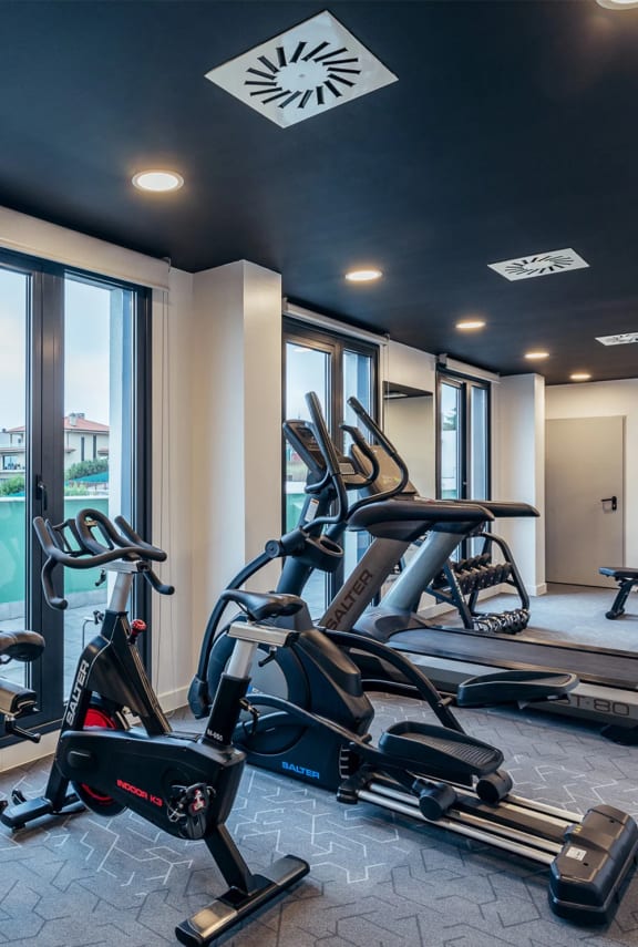 the gym is equipped with treadmills and other exercise equipment