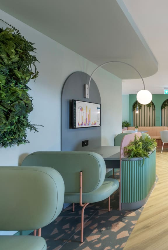 a dentist room with chairs and a table with a laptop