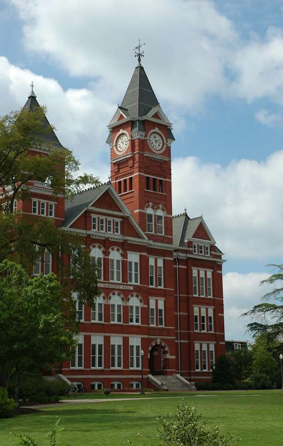 A large red brick building with a clock tower.