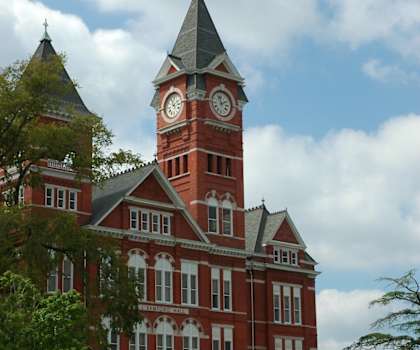 A large red brick building with a clock tower.