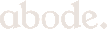 The image shows the word "abode" in large white letters on a black background.