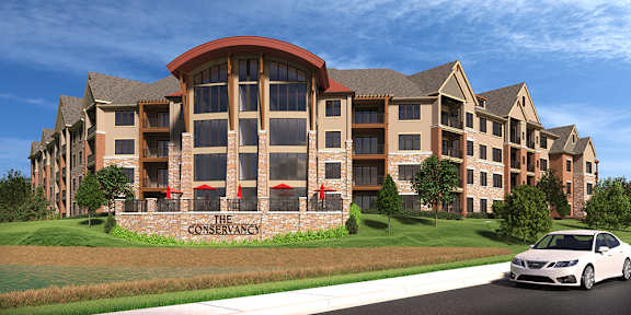 A large building with a sign that says "The Conservancy" in front of it.