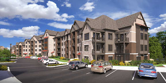 A large, modern apartment complex with a parking lot in front.