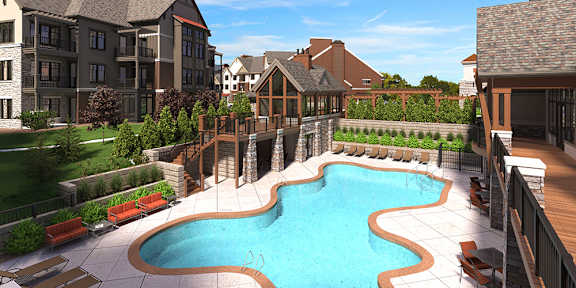 A large outdoor swimming pool surrounded by a wooden deck and lounge chairs.