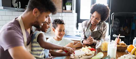 Family in the kitchen at Salish Flats APARTMENTS, Airway Heights, WA 99001
