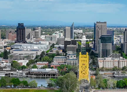 A cityscape with a yellow structure in the foreground.