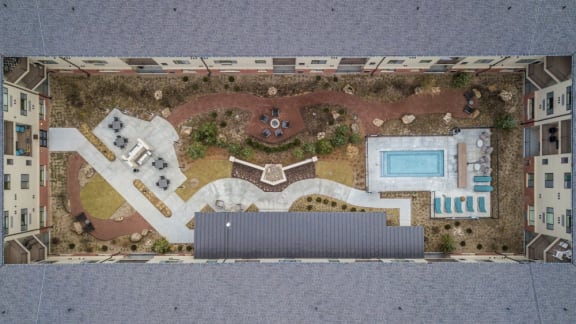 Arial view of the outdoor courtyard enclosed by The Conrad apartment building