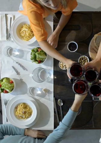 a group of people sitting at a table drinking wine  at The Grove at Portofino Vineyards, Fort Myers, FL