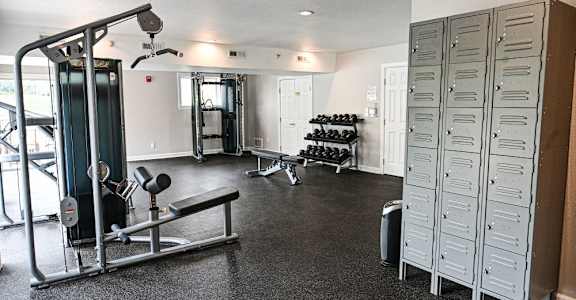 a home gym with weights and other exercise equipment