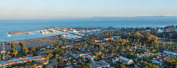 A coastal town with a pier and a body of water.