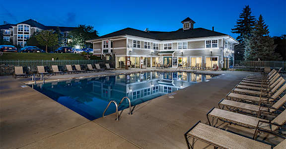 the resort style pool is available for residents to enjoy at night
