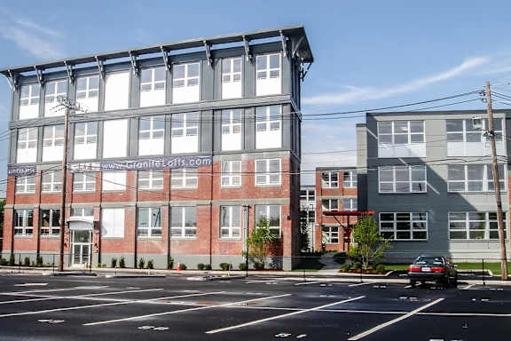A large building with a website address on the front.