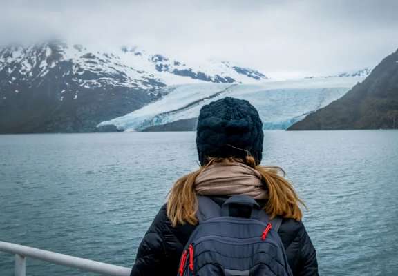 a woman on a boat looking out at a glacier at Northridge Terrace Apartments, Palmer, AK, 99645