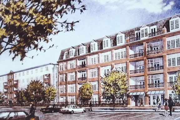 A large building with a lot of windows and balconies.