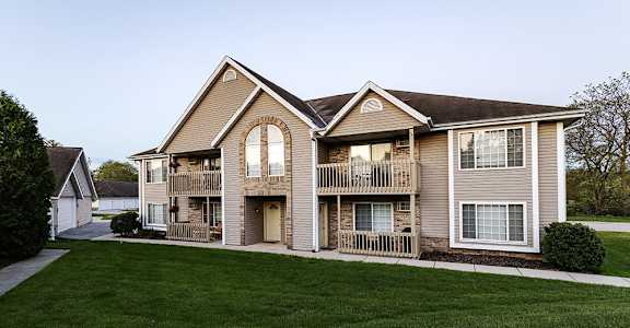 an exterior view of a house with a yard