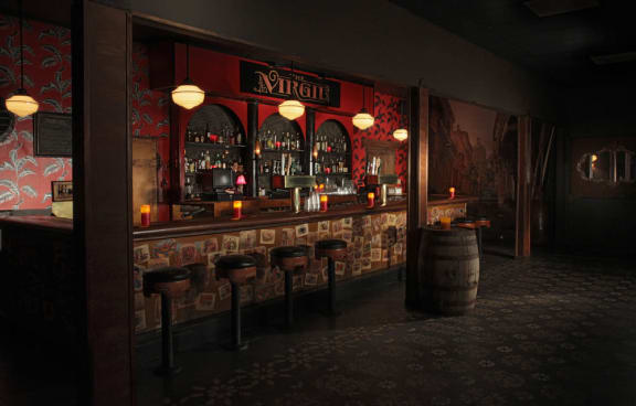 a rendering of a bar with stools and a barrel