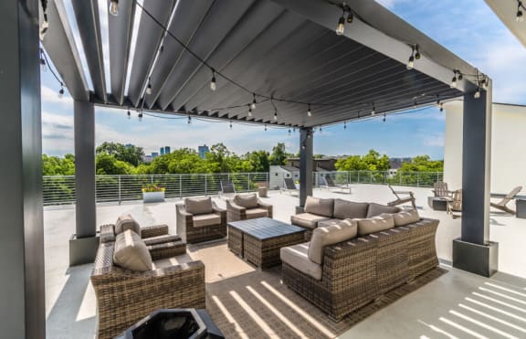 a roof deck with couches and a coffee table
