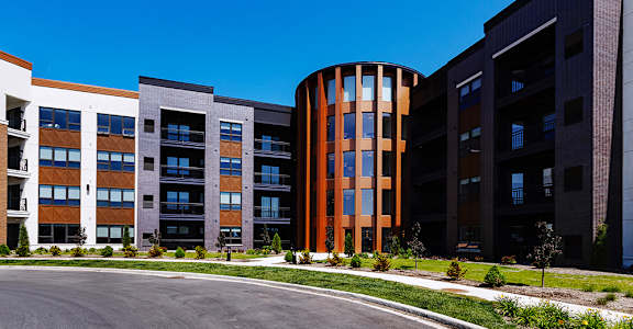 A modern building with a circular section in the middle.