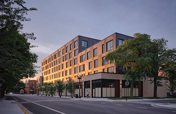 a rendering of an apartment building on a city street