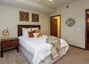 Thumbnail 14 of 26 - large bedroom with neutral artwork and a large walk-in closet