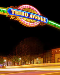 the sign for third avenue at night